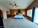 Spacious main bedroom with carpet floors, ceiling fan, ensuite bathroom and natural light at 14009 N 30Th St, Phoenix, AZ 85032