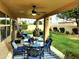 Covered patio with stylish outdoor furniture and a view of the well-manicured backyard at 14009 N 30Th St, Phoenix, AZ 85032