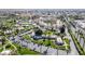 Aerial view of an apartment complex with manicured lawns, parking areas, and palm-lined streets at 14250 W Wigwam Blvd # 1326, Litchfield Park, AZ 85340