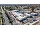 Aerial view of a retail complex with parking, palm trees, and pedestrian areas at 14250 W Wigwam Blvd # 1326, Litchfield Park, AZ 85340