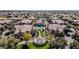 Aerial view of a community park with a gazebo, manicured lawns and trees among residential buildings at 14250 W Wigwam Blvd # 1326, Litchfield Park, AZ 85340