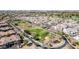 Aerial view of a landscaped community park offering grassy areas, walking paths, and palm trees at 14250 W Wigwam Blvd # 1326, Litchfield Park, AZ 85340