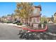 Pleasant townhome exterior with a private garage, tasteful landscaping, and a well-manicured lawn at 14250 W Wigwam Blvd # 1326, Litchfield Park, AZ 85340