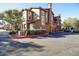 Beautiful townhome exterior boasting a private garage, tasteful landscaping, and a lovely neighborhood setting at 14250 W Wigwam Blvd # 1326, Litchfield Park, AZ 85340