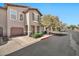 Charming townhome featuring a private garage, inviting entryway, and neat landscaping for curb appeal at 14250 W Wigwam Blvd # 1326, Litchfield Park, AZ 85340