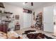 Charming bedroom features a cowhide rug, rustic decor, and wood-look tile flooring at 1444 W Gail Rd, San Tan Valley, AZ 85144