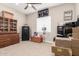 This neutral bedroom features a ceiling fan, a window for natural light, and unique decor items at 1444 W Gail Rd, San Tan Valley, AZ 85144