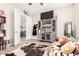 Bedroom featuring vintage furnishings, a doorway leading to another room, and a cowhide rug at 1444 W Gail Rd, San Tan Valley, AZ 85144