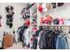 Organized walk-in closet featuring shelving, hanging rods, and ample storage for clothing and accessories at 1444 W Gail Rd, San Tan Valley, AZ 85144