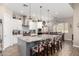 Spacious kitchen featuring a large granite island, stainless steel appliances, and white cabinetry at 1444 W Gail Rd, San Tan Valley, AZ 85144