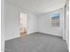 Bedroom featuring neutral carpeting, closet, and an ensuite bathroom at 14782 W El Cortez Pl, Surprise, AZ 85387