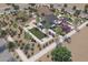 Overhead view of the community park with a covered ramada, playground, and bocce ball court at 14782 W El Cortez Pl, Surprise, AZ 85387