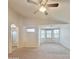 Large bedroom showcasing a ceiling fan, neutral carpet, and a bay window with natural light at 15232 W Edgemont Ave, Goodyear, AZ 85395