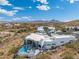 Breathtaking aerial view of a modern home with a pool, set against a scenic desert landscape at 15642 E Palatial Dr, Fountain Hills, AZ 85268