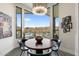 Breakfast nook featuring a modern chandelier, view of the pool, and desert landscape at 15642 E Palatial Dr, Fountain Hills, AZ 85268