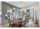 Dining room with designer lighting, gray accent wall, and view of the backyard patio at 15642 E Palatial Dr, Fountain Hills, AZ 85268