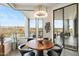 Modern dining area with stylish chandelier, copper table, and large windows offering panoramic views at 15642 E Palatial Dr, Fountain Hills, AZ 85268