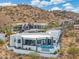 Aerial view of a modern home showcasing the pool, patio, and beautiful desert surroundings at 15642 E Palatial Dr, Fountain Hills, AZ 85268