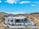 Aerial view of a modern home showcasing the architectural design, pool, and desert landscape at 15642 E Palatial Dr, Fountain Hills, AZ 85268