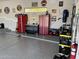 Well-organized garage with epoxy flooring, red storage cabinets and car accessories at 15642 E Palatial Dr, Fountain Hills, AZ 85268