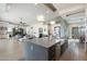 Spacious kitchen with an island, modern pendant lights, and open layout to the living area at 15642 E Palatial Dr, Fountain Hills, AZ 85268