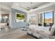 Main bedroom with a ceiling fan, mountain views, and a balcony at 15642 E Palatial Dr, Fountain Hills, AZ 85268