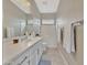 Well-lit bathroom with a combination shower and tub, featuring a long vanity at 15829 W Bonitos Dr, Goodyear, AZ 85395