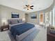 Serene main bedroom featuring a ceiling fan, natural light, and tasteful decor at 15829 W Bonitos Dr, Goodyear, AZ 85395