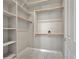 Walk-in closet features built-in shelving, providing ample storage space at 15829 W Bonitos Dr, Goodyear, AZ 85395