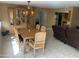 Open dining area with a wooden table, comfortable seating, and stylish chandelier for elegant meals at 17429 E La Pasada Dr, Fountain Hills, AZ 85268