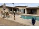 Backyard pool with outdoor lounge area, seating, and lush landscaping for relaxation at 17429 E La Pasada Dr, Fountain Hills, AZ 85268