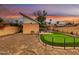 Sunset backyard view including putting green and desert landscaping at 1822 N 16Th Ave, Phoenix, AZ 85007