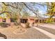 View of the home's facade and drought-resistant yard, showcasing the sidewalk and desert landscape at 1822 N 16Th Ave, Phoenix, AZ 85007