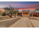 Exterior home view of a property boasting a tiled roof and a low-maintenance desert landscape at 1822 N 16Th Ave, Phoenix, AZ 85007