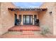 The front patio has a tile floor, dark furniture, and a view of the front doors at 1822 N 16Th Ave, Phoenix, AZ 85007