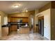 Spacious kitchen with stainless steel appliances, an island, and ample cabinet space at 1870 N 128Th Dr, Avondale, AZ 85392