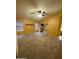 Spacious main bedroom featuring neutral carpeting, two windows and a ceiling fan at 1870 N 128Th Dr, Avondale, AZ 85392