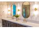 Bathroom featuring dual sinks, marble countertops, and elegant lighting at 1918 W Medinah Ct, Anthem, AZ 85086