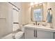 Bathroom features a shower, tub, toilet and vanity with a mirror at 1918 W Medinah Ct, Anthem, AZ 85086