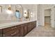 Bathroom featuring dual sinks, marble countertops, and modern fixtures at 1918 W Medinah Ct, Anthem, AZ 85086