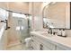 Modern bathroom featuring walk-in shower with black hardware and sleek white vanity at 1918 W Medinah Ct, Anthem, AZ 85086