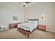 Comfortable bedroom with hardwood furnishings, ceiling fan, and recessed lighting at 1918 W Medinah Ct, Anthem, AZ 85086