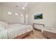 A modern bedroom with neutral tones and a mounted television at 1918 W Medinah Ct, Anthem, AZ 85086