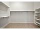 Walk in closet with open storage and racks at 1918 W Medinah Ct, Anthem, AZ 85086