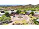 Aerial view of the community clubhouse with meticulously kept grounds, landscaping, and circular driveway at 1918 W Medinah Ct, Anthem, AZ 85086