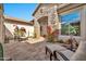 Tranquil courtyard featuring stone accents, comfortable seating, and lush vegetation at 1918 W Medinah Ct, Anthem, AZ 85086