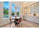 Elegant dining area with chandelier, built in cabinets, and views of the pool at 1918 W Medinah Ct, Anthem, AZ 85086