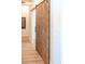 Interior view of a sliding wooden door in a hallway at 1918 W Medinah Ct, Anthem, AZ 85086