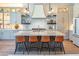 Stunning kitchen island with stone countertop and seating for four, perfect for entertaining guests at 1918 W Medinah Ct, Anthem, AZ 85086