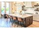 Modern kitchen with large island, pendant lighting, and stainless steel appliances at 1918 W Medinah Ct, Anthem, AZ 85086